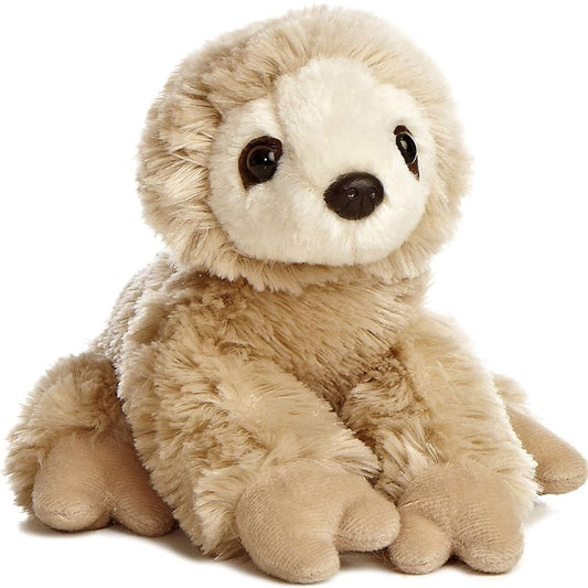 Angled front view of the Aurora Mini Flopsie Sloth 8-inch plush resting on its belly, featuring shaggy tan fur and a cream facial disc.
