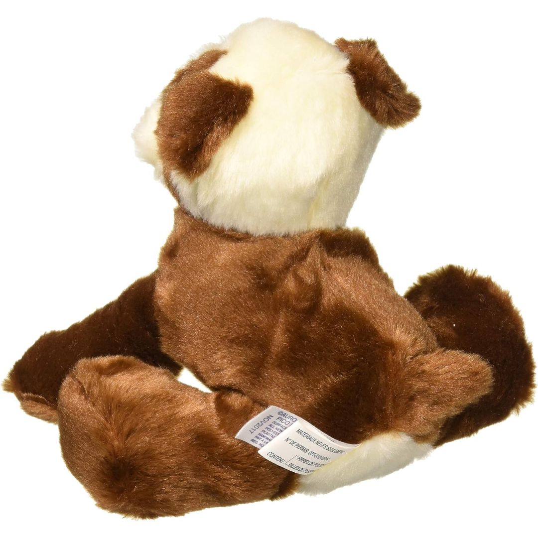 Rear view of the English Bulldog stuffed animal from behind, showing its cream-colored back patch, extended hind legs, and fabric tag.