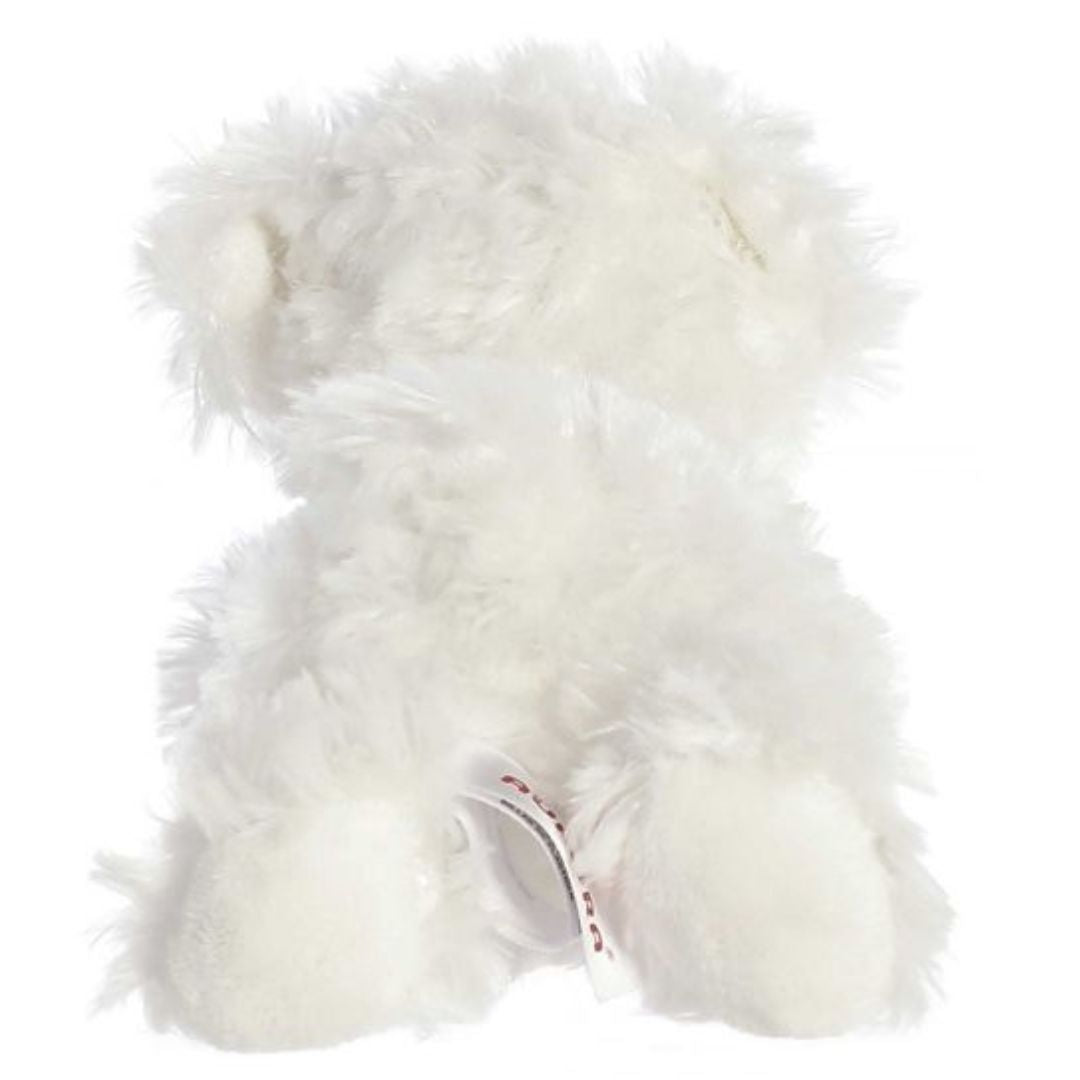 Rear view of the white dog plush showing its fluffy back, rear paws, and a cute perky tail.