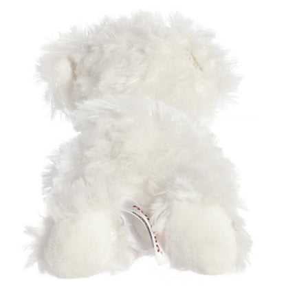 Rear view of the white dog plush showing its fluffy back, rear paws, and a cute perky tail.