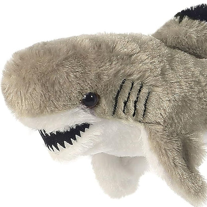 Close-up view of the soft shark plush highlighting its toothy smile, dark eye, and black stitched side gills.