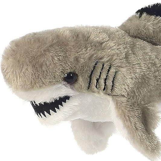 Close-up view of the soft shark plush highlighting its toothy smile, dark eye, and black stitched side gills.