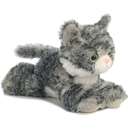Angled side view of the Aurora Mini Flopsie Lily the Cat 8-inch plush resting on its belly, featuring grey tabby fur and a white muzzle.