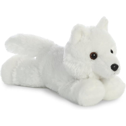Angled view of the Aurora Mini Flopsie 8-inch White Wolf plush resting on its belly, showing its fluffy pristine white fur and tail.