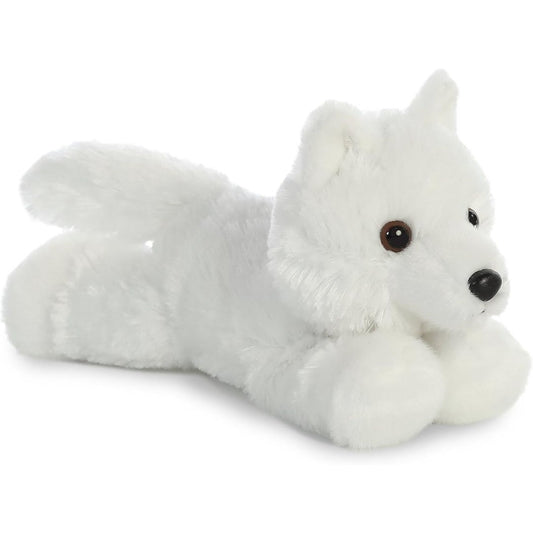 Angled view of the Aurora Mini Flopsie 8-inch White Wolf plush resting on its belly, showing its fluffy pristine white fur and tail.