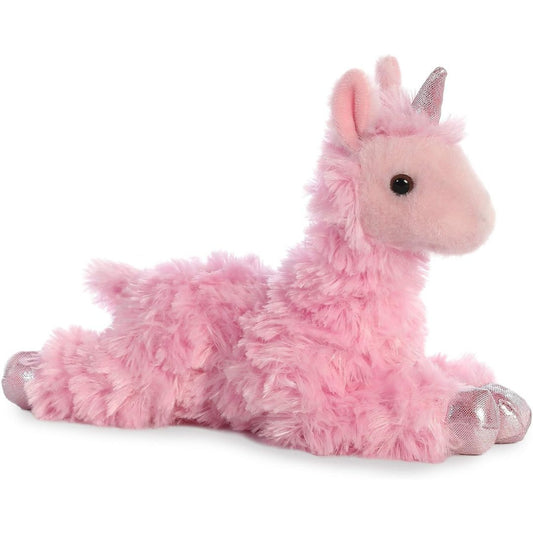 Angled side view of the Aurora Mini Flopsie Llamacorn 8-inch plush resting on its belly, featuring fluffy pink fur and a metallic silver horn.