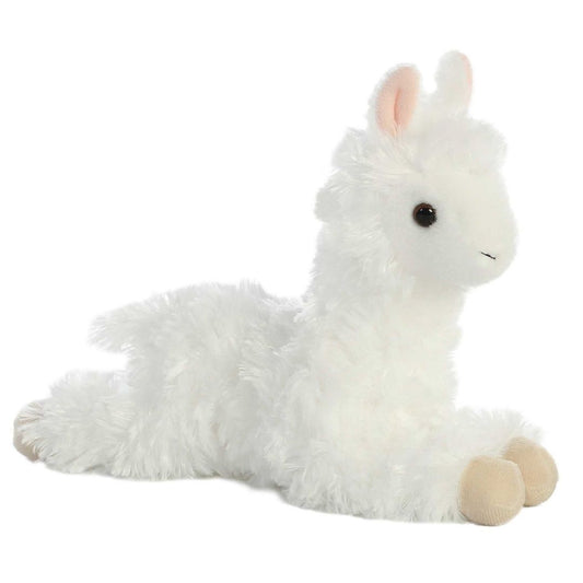 Angled side view of the Aurora Mini Flopsie Ansy Alpaca 8-inch plush resting on its belly, featuring fluffy wooly white fur.