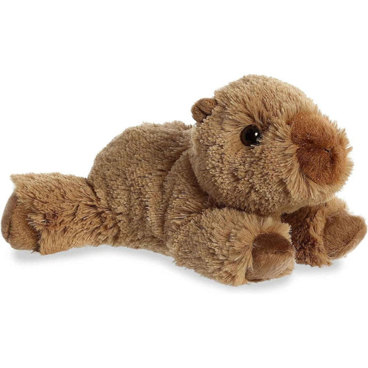 Side angle showing the unique floppy resting pose of the Aurora Charlie Capybara plush toy.