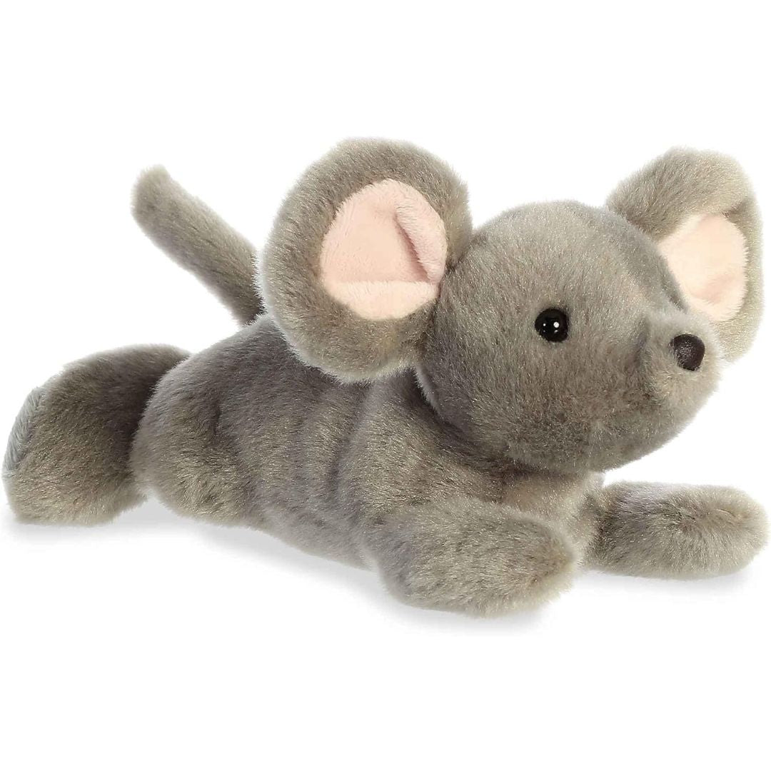 Angled side view of the Aurora Mini Flopsie Missy Mouse 8-inch plush resting on its belly, featuring soft grey fur and large ears.
