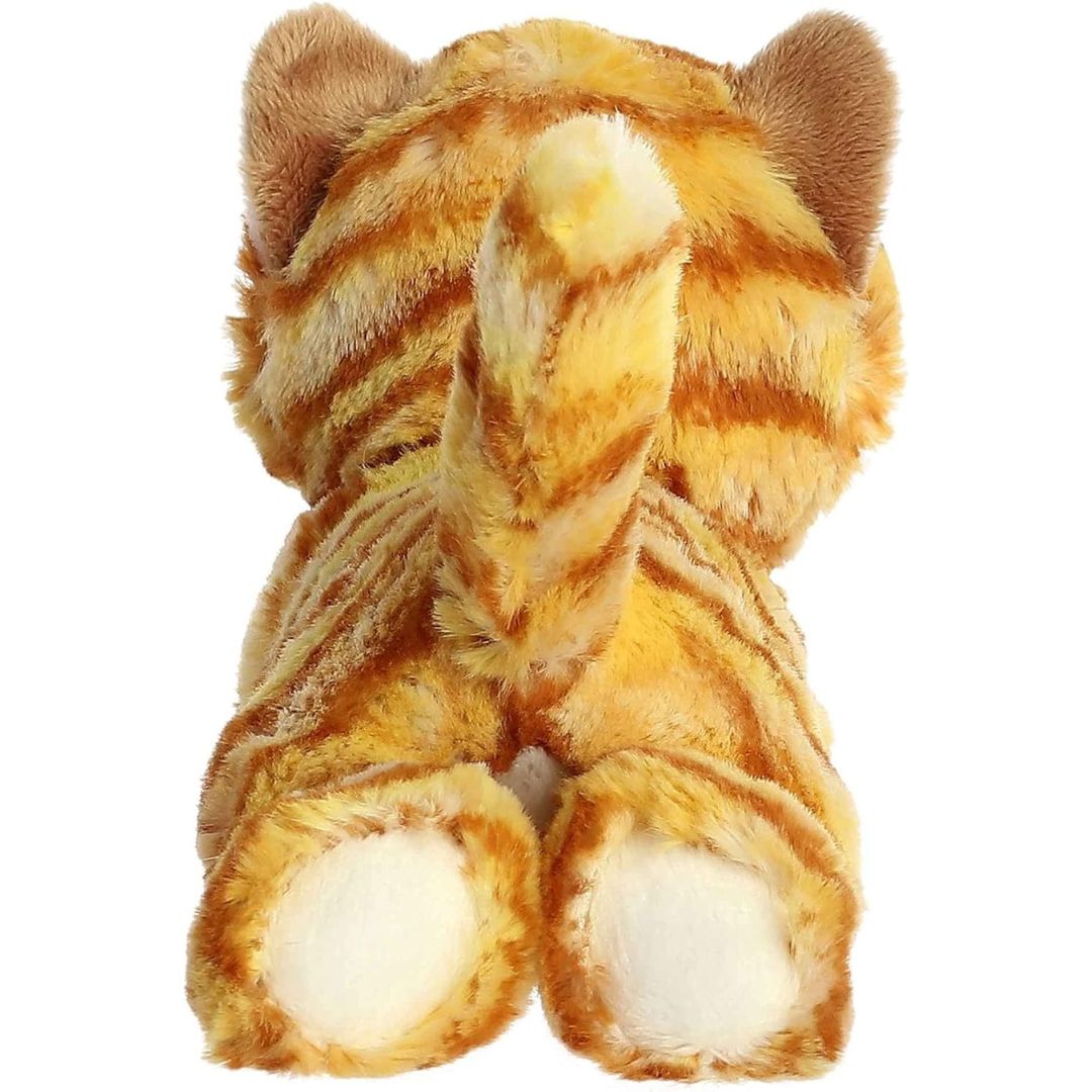 Direct back view of the orange cat plush highlighting its perky striped tail and the white bottoms of its hind paws.