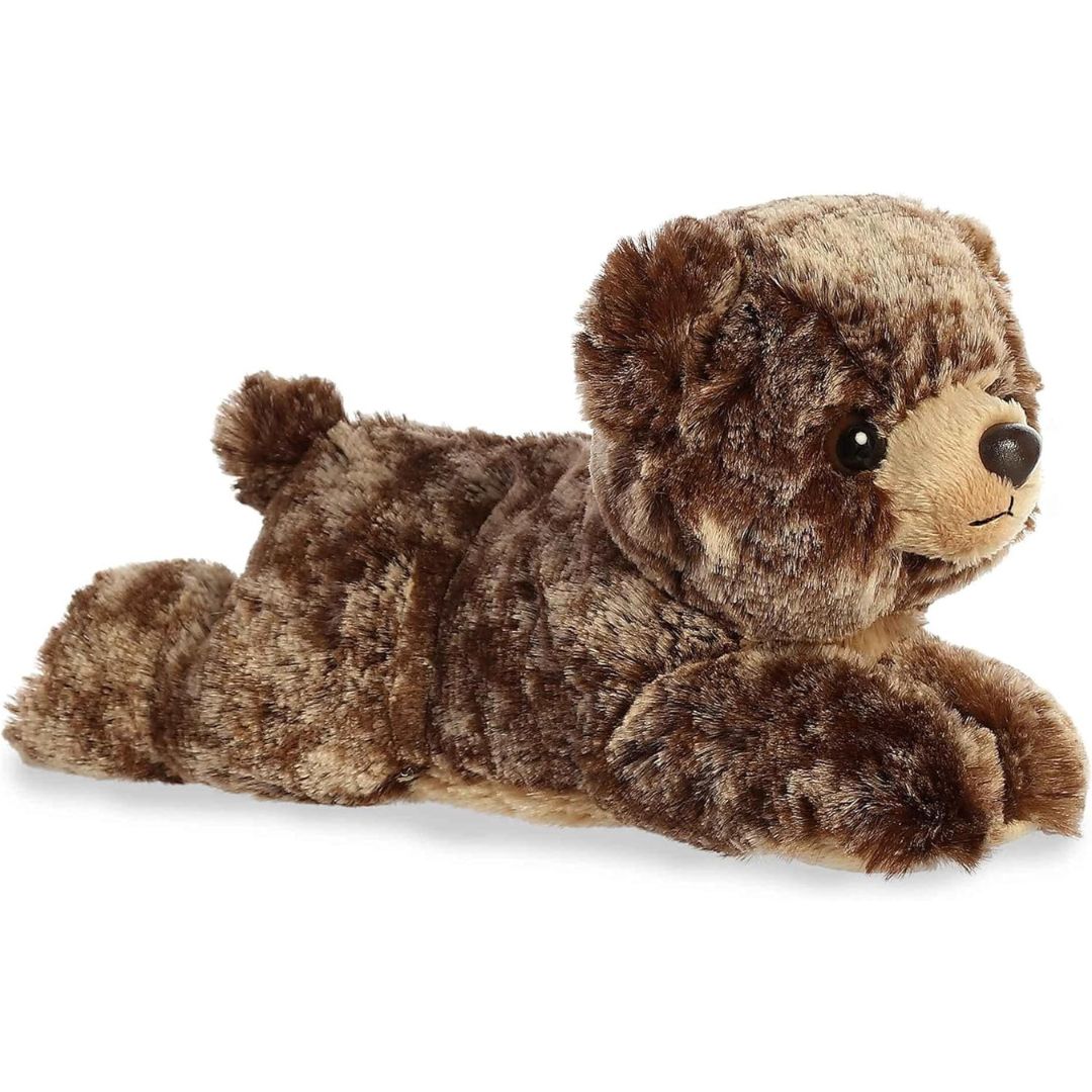 Angled side profile view of the 8-inch Aurora Mini Flopsie Brownie Bear plush resting on its belly.
