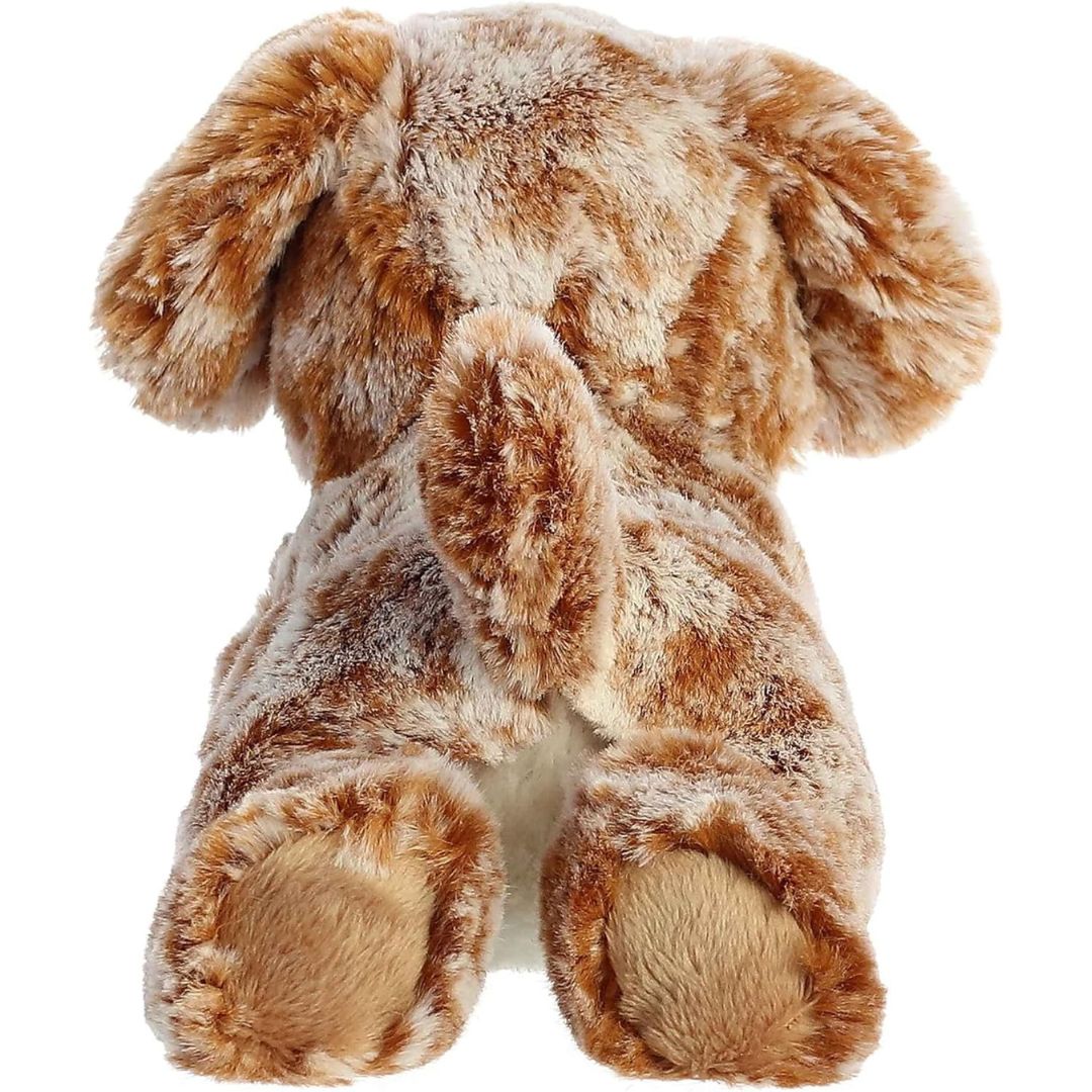 Rear view of the dog plush from behind, showing its mottled brown back, extended hind legs with smooth paw pads, and a small upright tail.