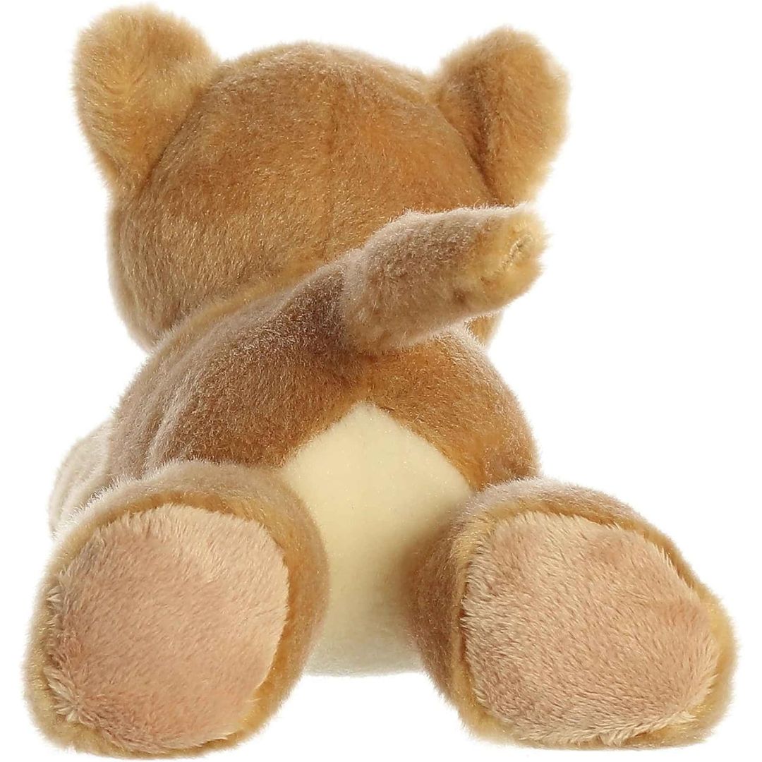 Rear view of the Leah Lioness plush showing its soft back legs, tan paws, and a long outstretched tail.