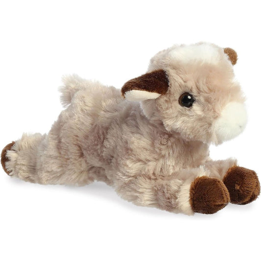 Angled side view of the Aurora Mini Flopsie Paisley Goat 8-inch plush resting on its belly, featuring light brown fur and dark brown hooves.