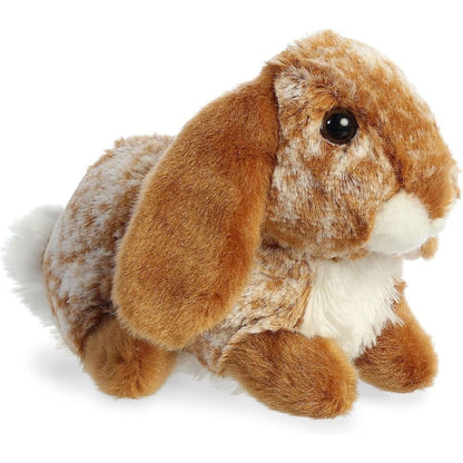 Angled view of the Aurora Mini Flopsie 8-inch Lopso Bunny plush showing its speckled brown and white fur, long floppy ears, and white chest.