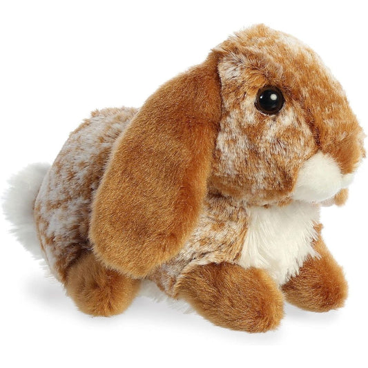 Angled view of the Aurora Mini Flopsie 8-inch Lopso Bunny plush showing its speckled brown and white fur, long floppy ears, and white chest.