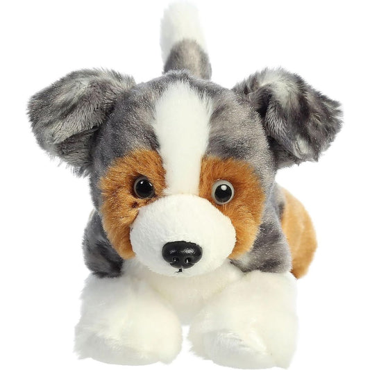 Straight-on front view of the Australian Shepherd puppy stuffed animal highlighting its white facial blaze, tan cheeks, and dark eyes.