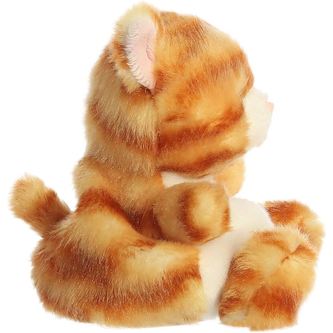 Side profile view of the Palm Pals Orange Kitty plush highlighting its perfectly squishy round body and orange tabby stripes.