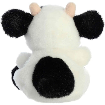 Back view of the cuddly black and white Palm Pals cow stuffed toy showing its tail and large spot.