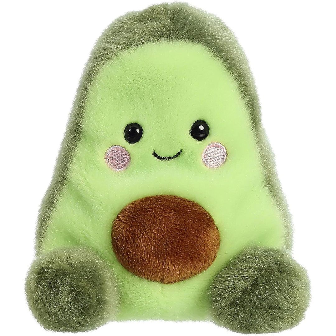 Front view of the adorable Aurora Airy Avocado stuffed animal featuring rosy pink cheeks, dark eyes, a sweet smile, and a round brown plush pit on its belly.