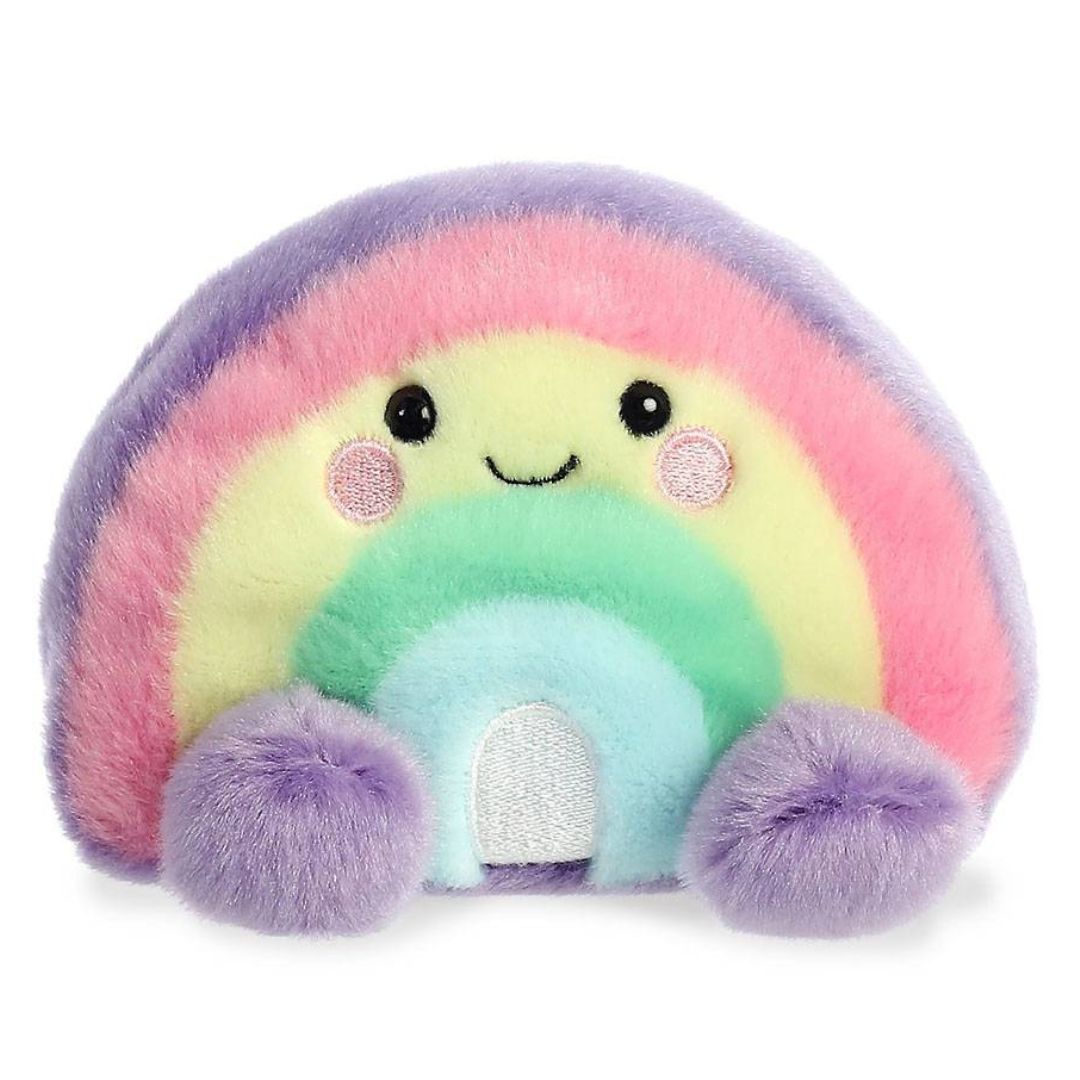 Front face view of the adorable Aurora Vivi Rainbow stuffed animal featuring blushing cheeks, a little smile, and fluffy purple feet.