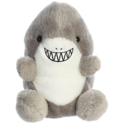 Front view of the adorable Aurora Chomps Shark stuffed animal featuring a wide embroidered smile with zig-zag teeth, dark eyes, and little grey side fins.