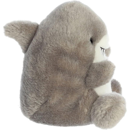 Side profile view of the Palm Pals Shark plush highlighting its perfectly squishy round body, white belly, and grey dorsal fin.