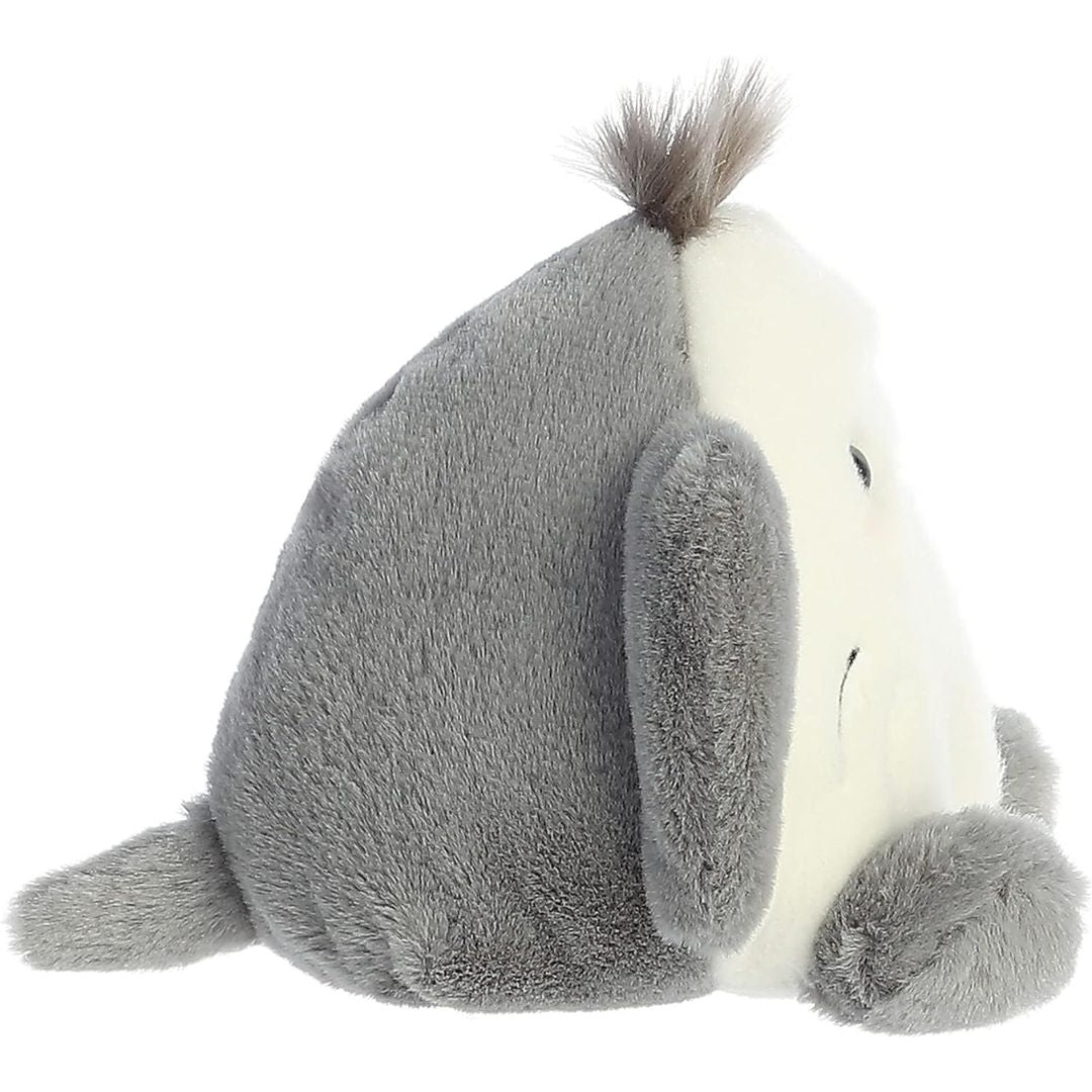 Side profile view thumbnail of the mini stingray plush showcasing its sloped grey back, flat white front face, and a small grey tail extending from the back.