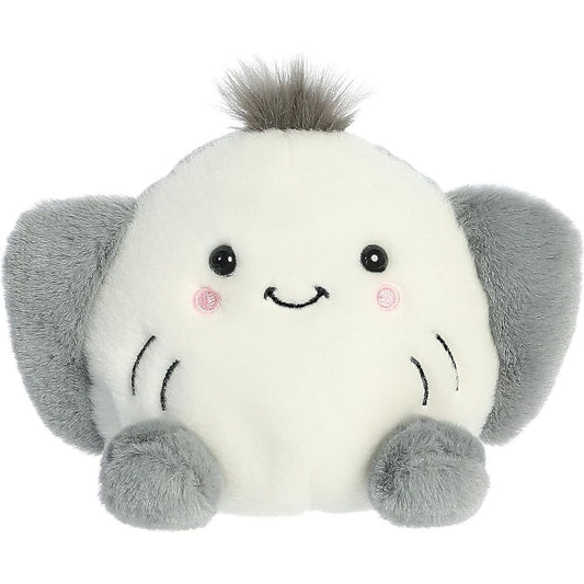 Aurora 5-inch Palm Pals Flapjack Stingray plush toy showing its round cream face with a stitched smile, rosy cheeks, outspread grey side wings, and a small spiky dark grey hair tuft on top.