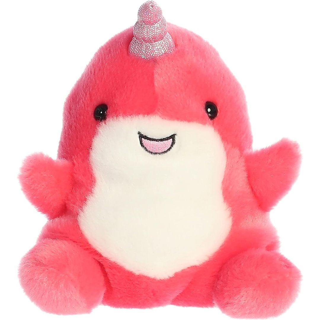 Front view of the cute Nia Narwhal plush sitting straight, highlighting its symmetrical flippers, dark safety eyes, and plush seated posture.