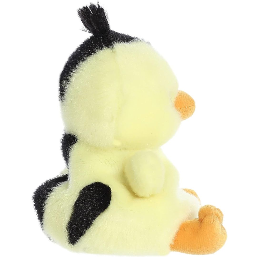 Side profile view of the Palm Pals Striped Chick plush highlighting its perfectly squishy body, black back stripes, and fluffy black top tuft.