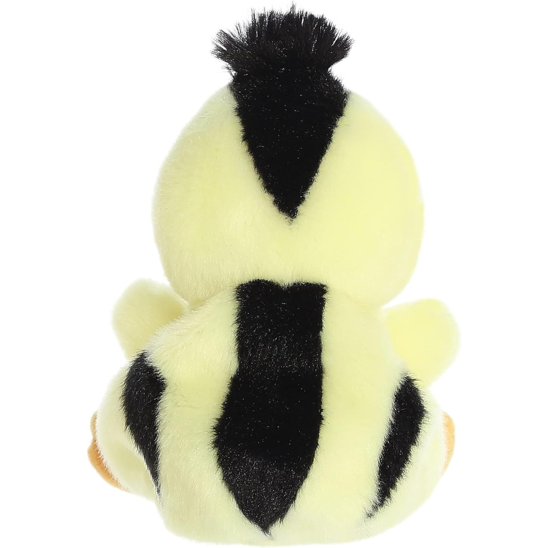 Back view of the Aurora Palm Pals chick plush toy showing its bright yellow back patterned with bold black stripes.