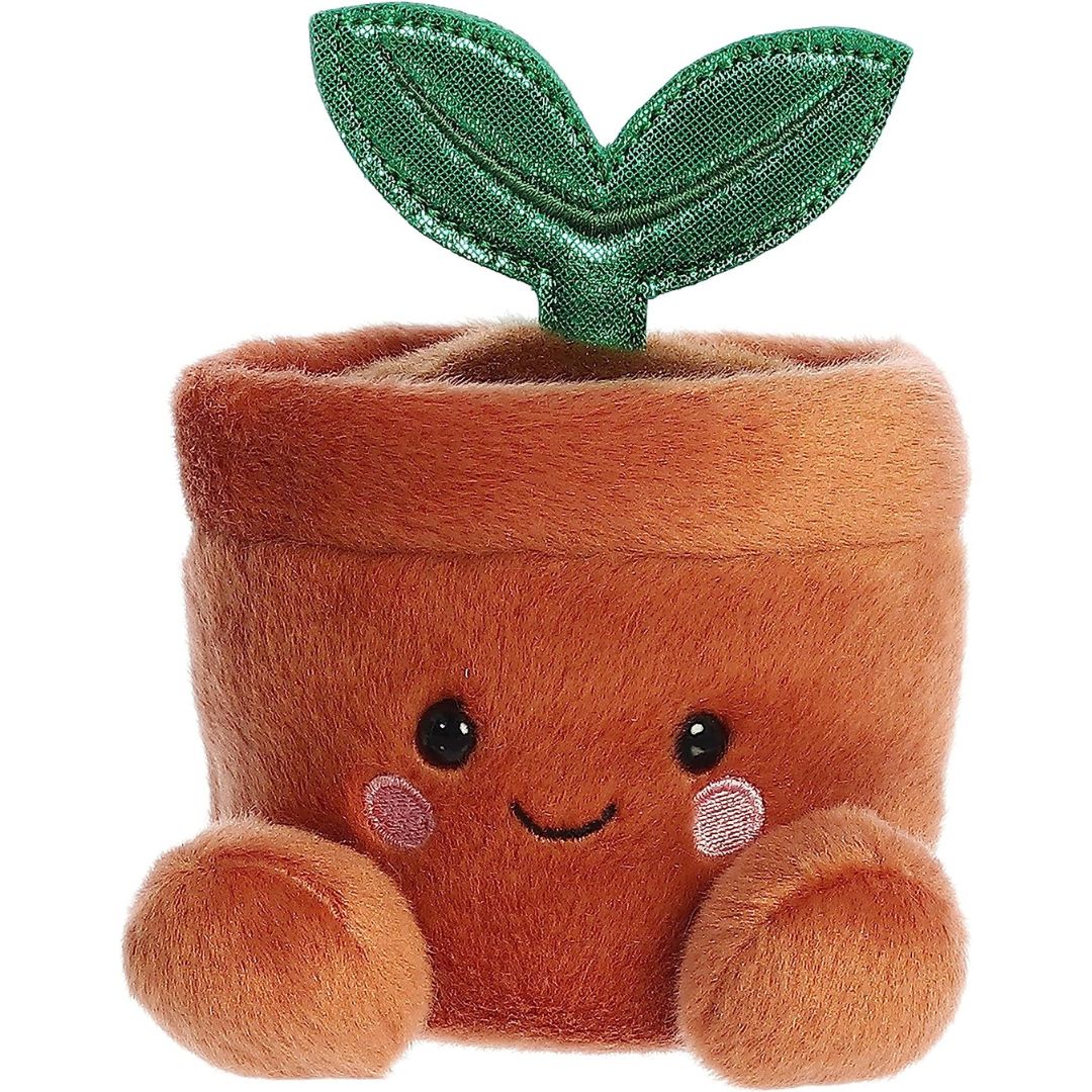 Straight-on front view of the soft brown Palm Pals potted plant plush featuring a happy face and rosy cheeks.