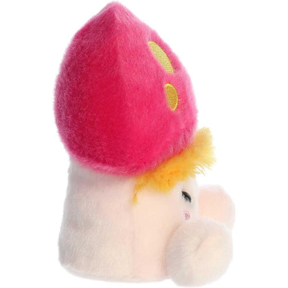 Side profile view thumbnail of the mini mushroom plush showcasing its rounded pink cap profile, fuzzy yellow gill layer, and soft seated posture.