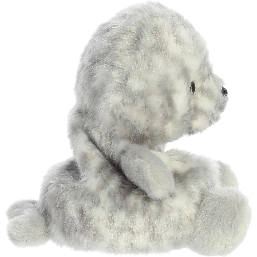 Side profile view of the Palm Pals Harbor Seal plush highlighting its round, perfectly squishy body and back flippers.