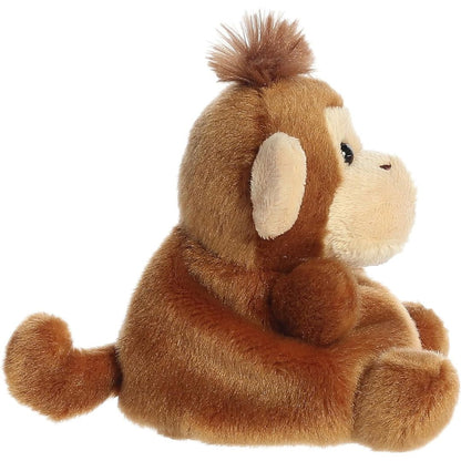 Side profile view thumbnail of the mini monkey plush showcasing its rounded back, soft cream ear profile, and long brown tail extending behind.