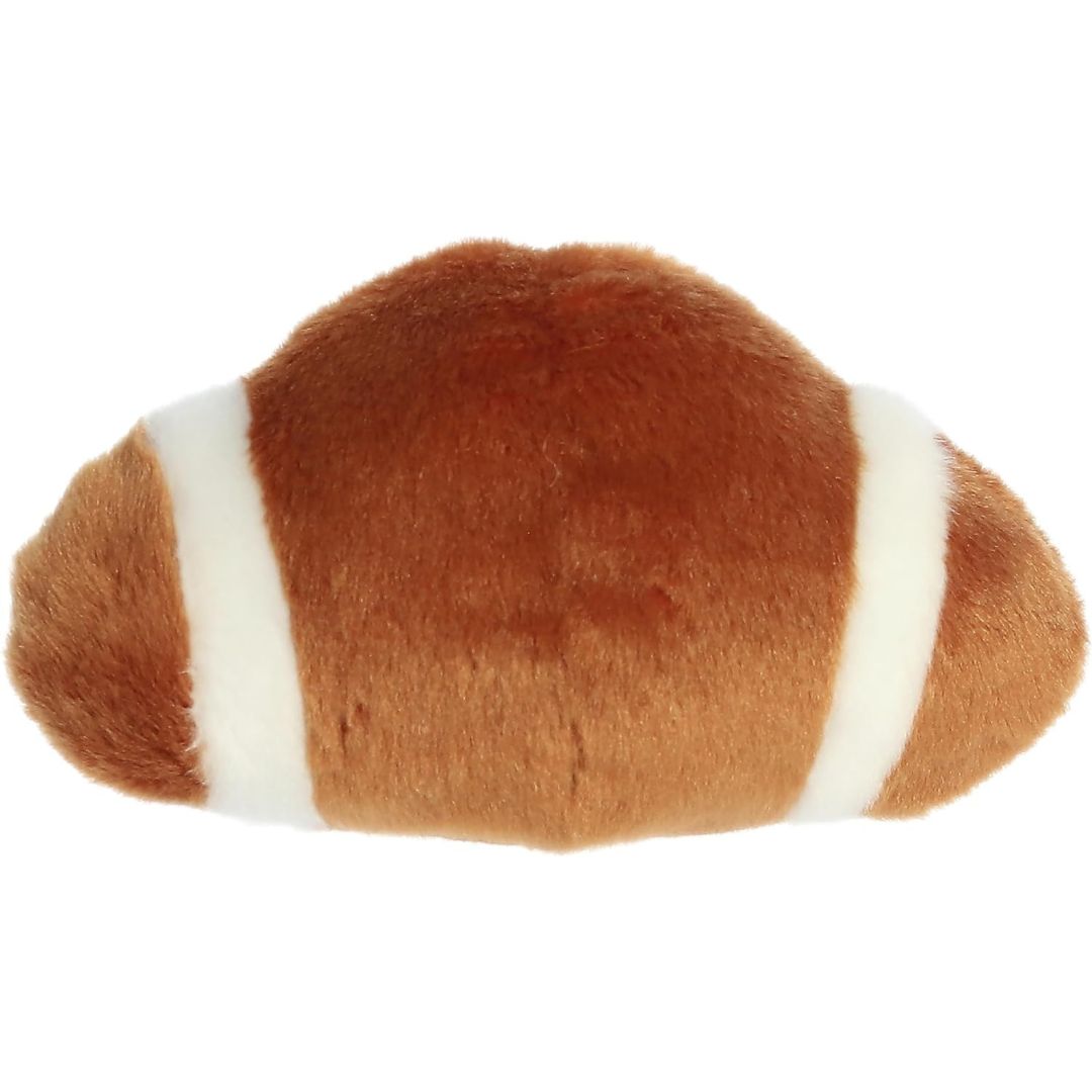 Rear view thumbnail of the Aurora football stuffed toy displaying its smooth, solid brown plush backing and white end stripes.