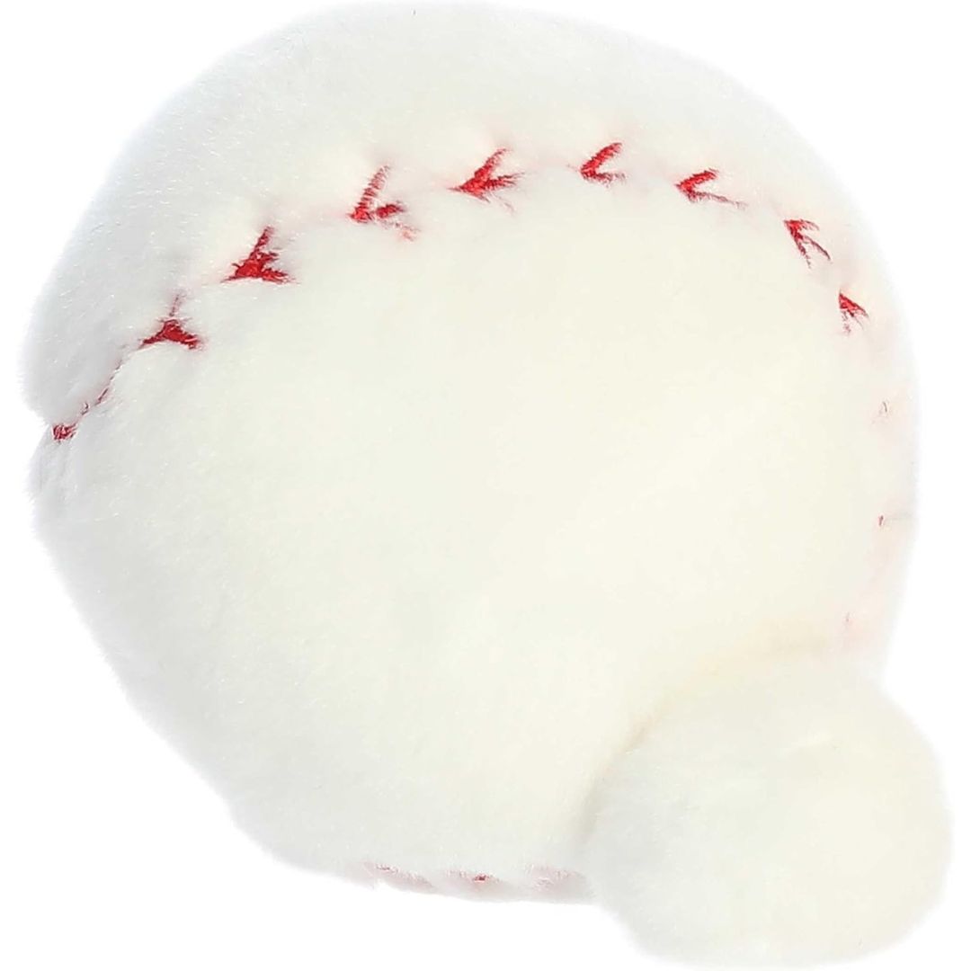 Side profile view of the Palm Pals Baseball plush highlighting its perfectly squishy round body and curved red embroidered stitching.