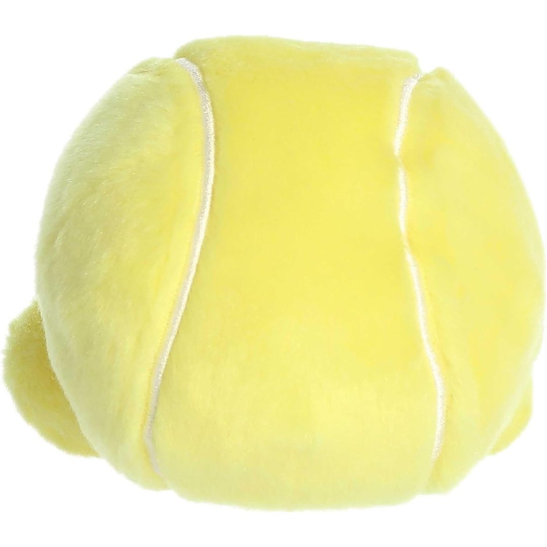 Back view of the Aurora Palm Pals Tennis Ball plush toy showing the continuous white curve details on the solid yellow plush back.