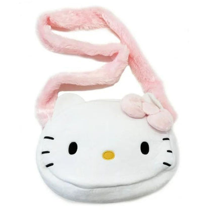 Angled view of the adorable Hello Kitty plush shoulder bag showing the fluffy pink crossbody strap resting playfully above her iconic face.