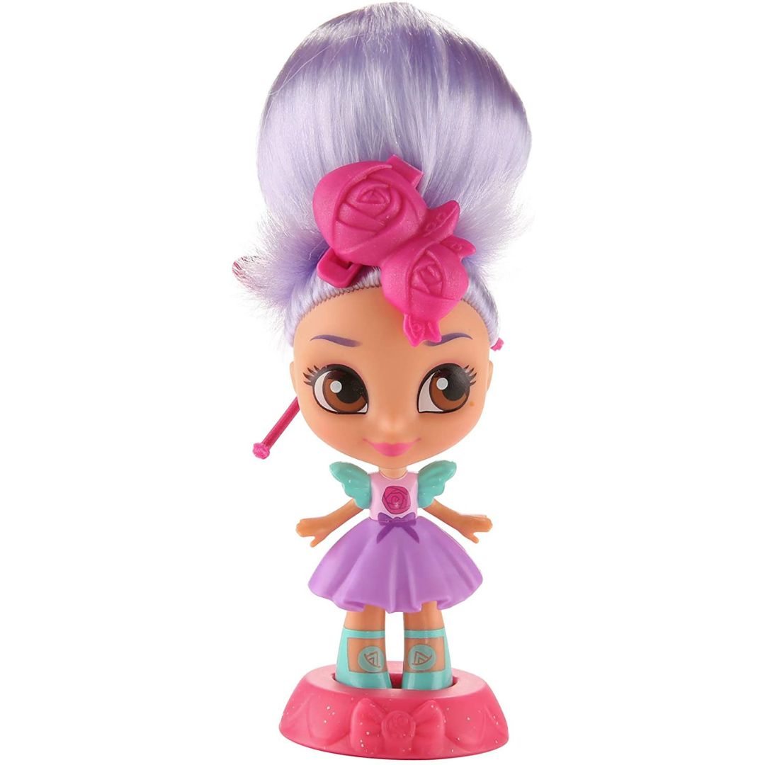 Fisher-Price Sunny Day Wonder Bun Blair 6-inch doll standing on a pink base with a purple updo hairstyle.