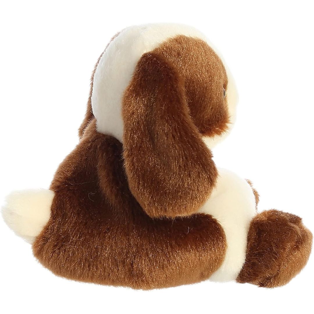 Side profile view of the Palm Pals brown and cream bunny plush highlighting its round, perfectly squishy bean-weighted body and long floppy ear.