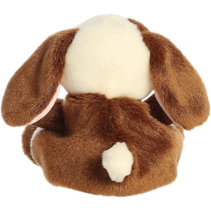 Back view of the Aurora Palm Pals bunny plush toy showing its solid brown back and a fluffy little cream cotton tail.