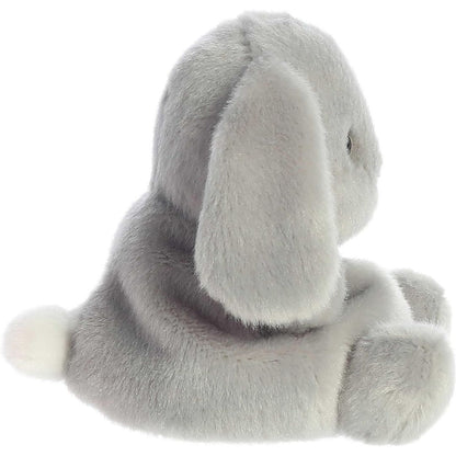 Side profile view of the Palm Pals grey bunny plush highlighting its round, perfectly squishy bean-weighted body and long floppy ear.