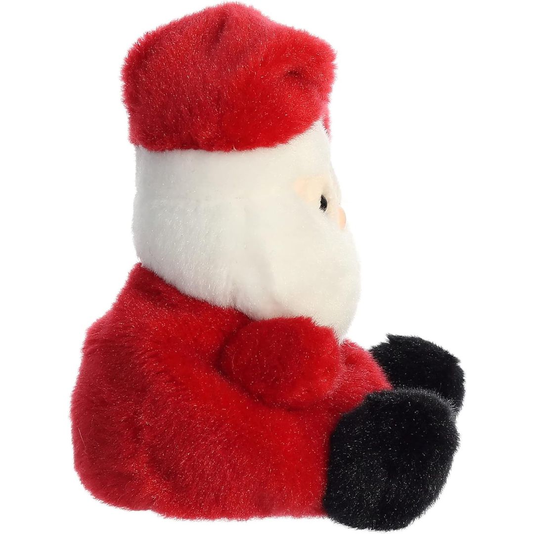 Side profile view thumbnail of the mini Santa plush showcasing its soft white beard profile, red suit, and black plush foot.