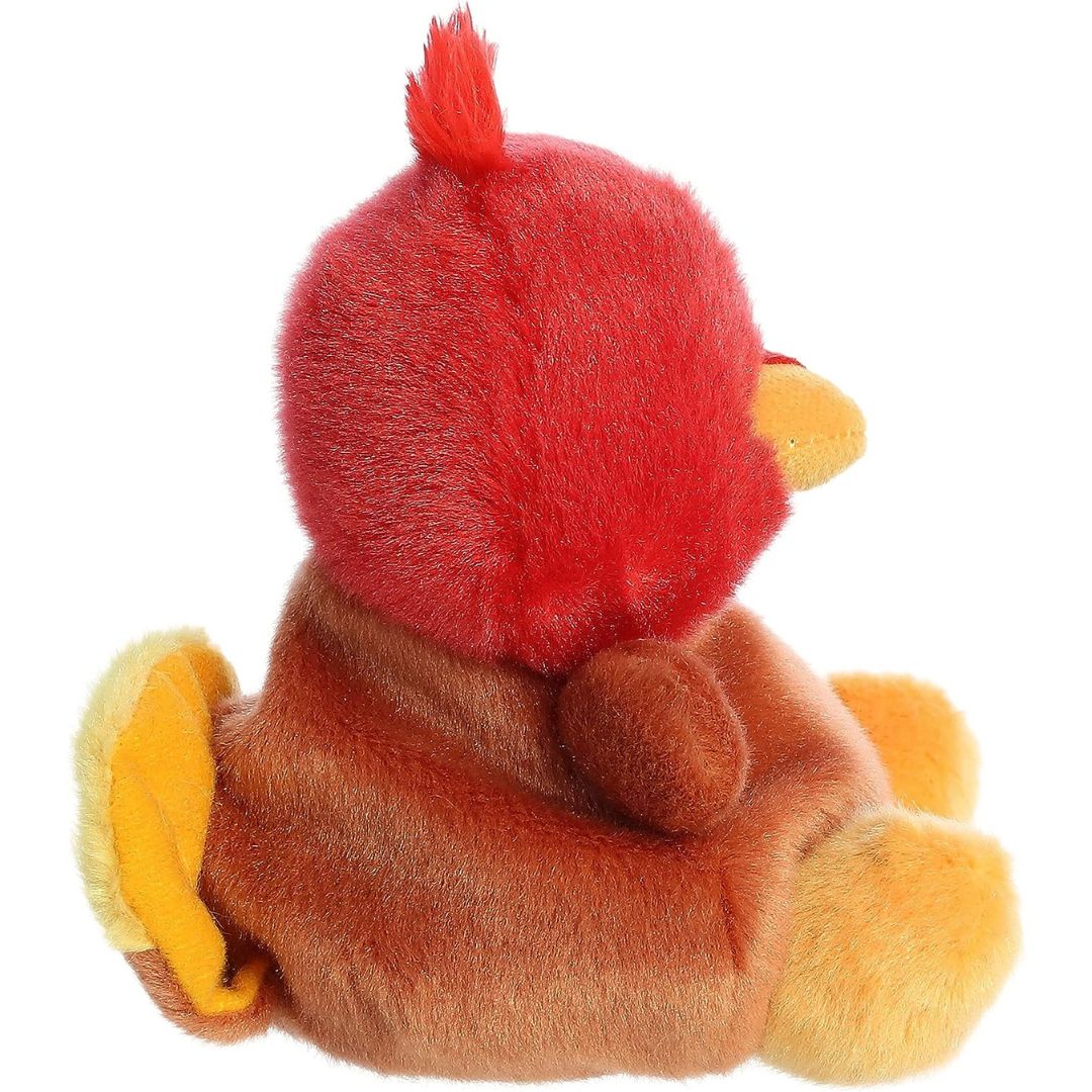 Side profile view thumbnail of the mini turkey plush showcasing its rounded brown body and the layered yellow and brown tail feathers on its back.