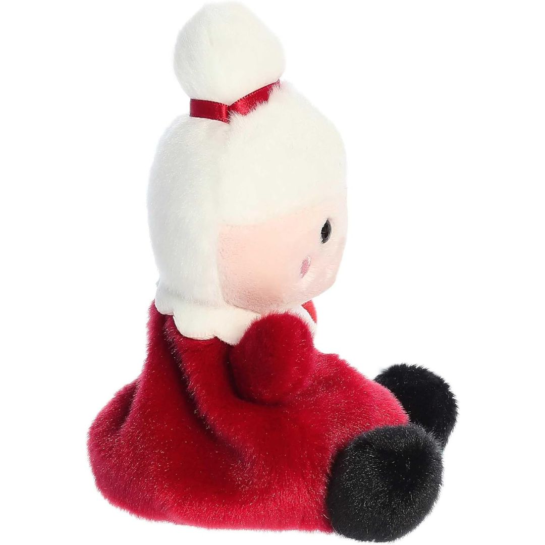 Side profile view thumbnail of the mini holiday plush showcasing her rounded white hair bun, red dress, and soft seated posture.