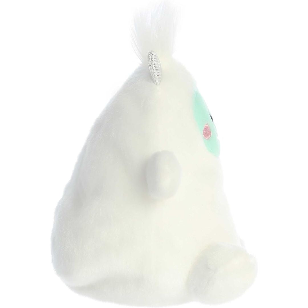 Side profile view thumbnail of the mini yeti plush showcasing its rounded white back profile, outspread arm, and upright silver horn.