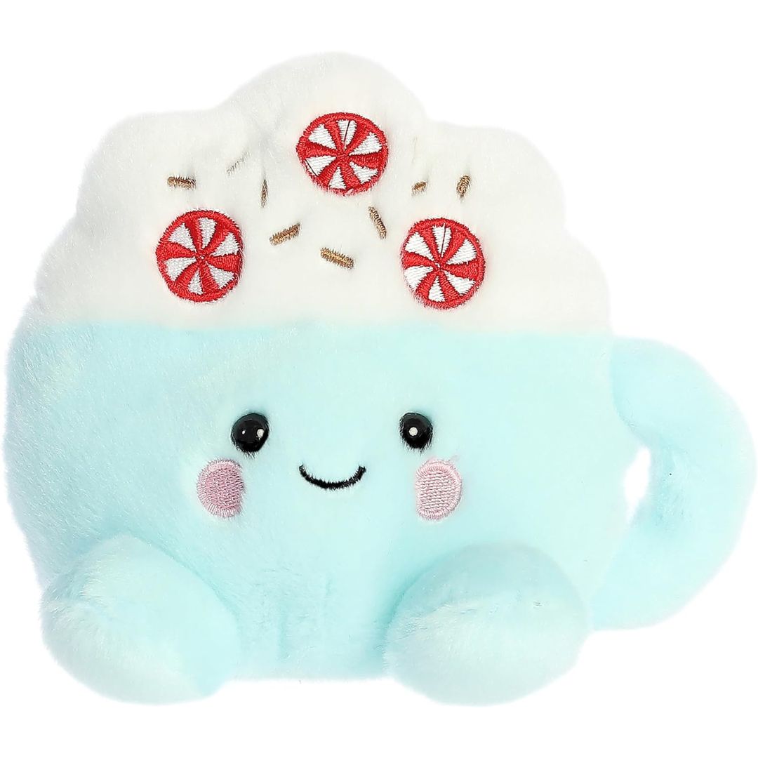 Front view thumbnail of the cute Piper Peppermint Latte plush sitting straight, highlighting its dark safety eyes, curved side handle, and small blue plush feet.