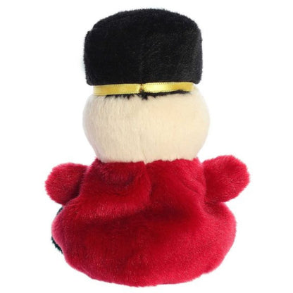 Rear view thumbnail of the Aurora holiday soldier stuffed toy displaying its smooth, solid red plush jacket and solid black hat from behind.